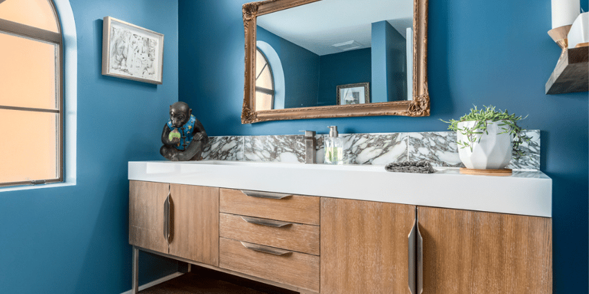 blue bathroom with warm wood vanity scottsdale