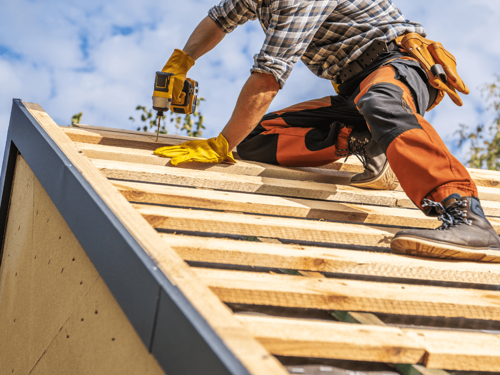Installing a Roof Underlayment Stock Image Installing a Roof Underlayment Stock Image