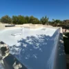 Arizona home roof during fall maintenance with clean gutters and inspected shingles