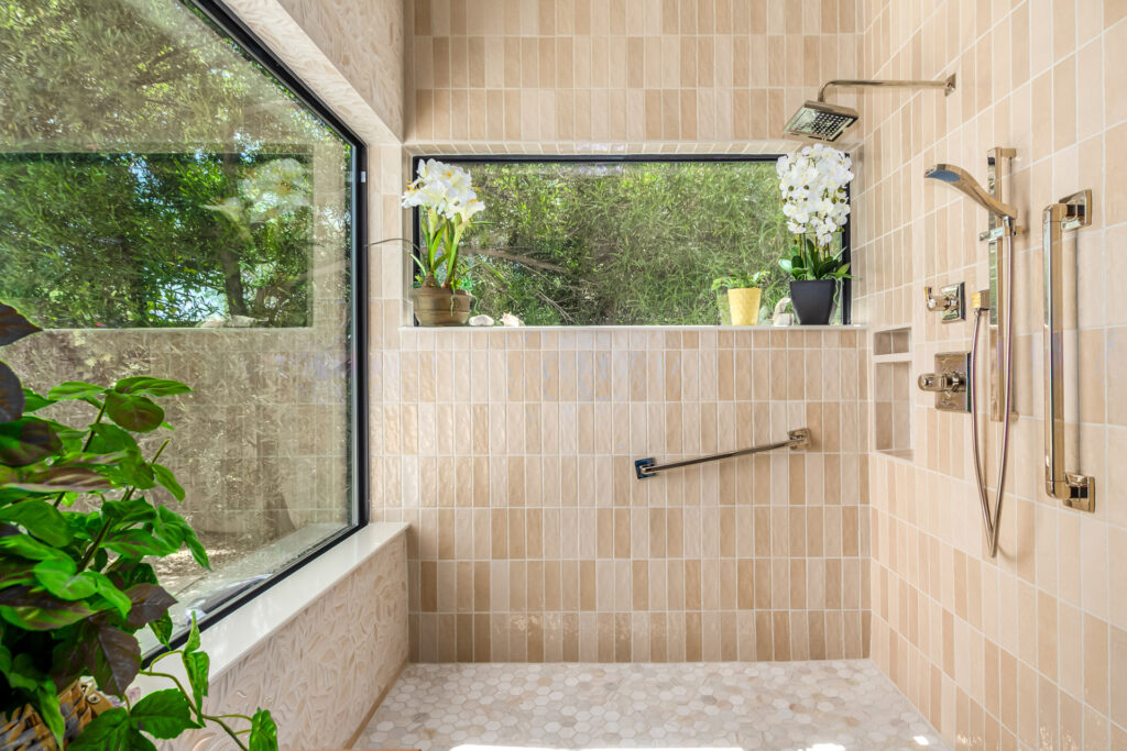 Modern spa bathroom remodel with freestanding tub, walk-in shower, and neutral tile in Scottsdale, AZ.