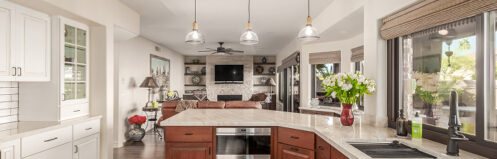 View of a kitchen that spills into the main living area