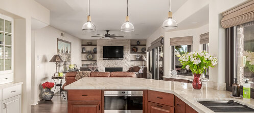 View of a kitchen that spills into the main living area