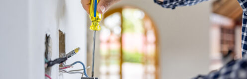 Person installing electrical outlet in beautiful home